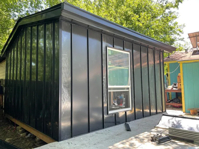 Black standing seam metal wall panels for Roof Inspection in Newmarket